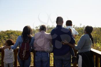 Multi Generation Family Standing On Outdoor Observation Deck