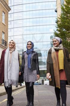 Group Of British Muslim Businesswomen Leaving Office