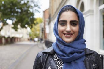 Portrait Of British Muslim Woman In Urban Environment