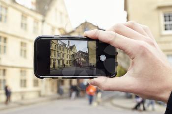OXFORD/ UK- OCTOBER 26 2016:Tourist Photographing Bridge Of Sighs In Oxford On Mobile Phone
