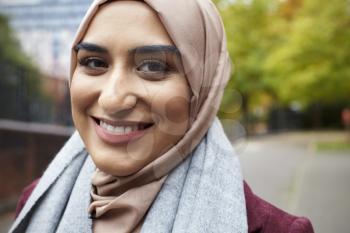 Portrait Of British Muslim Woman In Urban Environment