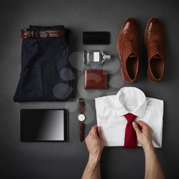 Person Arranging Male Business Clothing And Digital Tablet