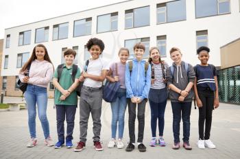 Portrait Of High School Student Group Standing Outside School Buildings