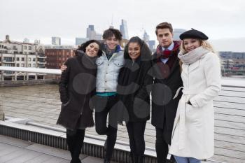 Portrait Of Young Friends Visiting London In Winter