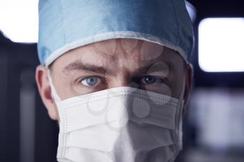 Male healthcare worker in scrubs, head shot