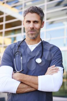 Middle aged white male healthcare worker outdoors, vertical
