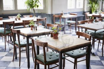 Tables Laid For Service In Empty Restaurant