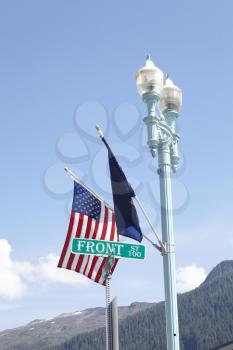 American And European Union Flags Flying From Lamp Post