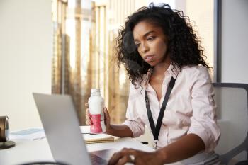 Busy Businesswoman With Laptop Sitting At Desk Having Protein Shake For Working Lunch