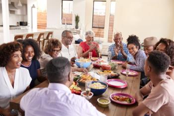 Three generation black family celebrating grandmother's birthday together,close up