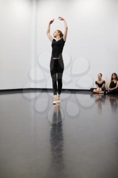 Female Ballet Student At Performing Arts School Performs For Class In Dance Studio