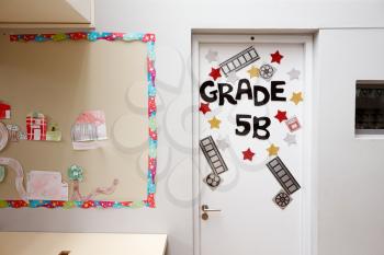 Door To Elementary School Classroom With Display Board