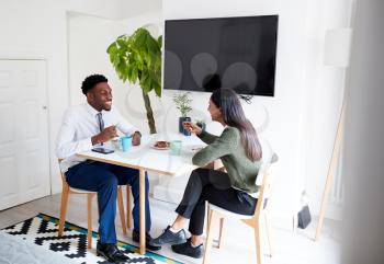 Business Couple At Home Eating Breakfast Before Leaving For Work