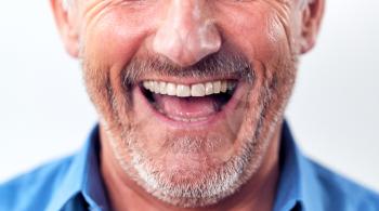 Close Up Of Mouth Of Laughing Mature Man In Studio