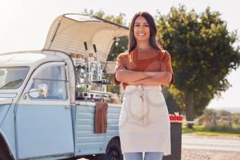 Portrait Of Woman Running Independent Mobile Coffee Shop Standing Outdoors Next To Van