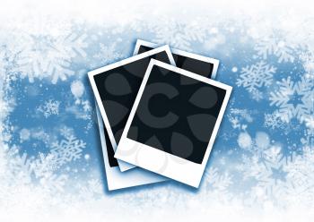 Polaroids on snowflake background