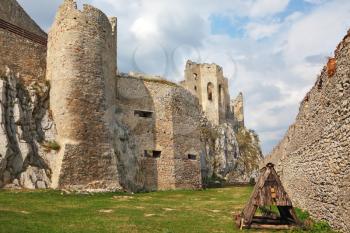 Battering-ram  in a dilapidated medieval citadel