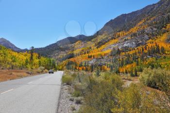 A trip through the colorful autumn desert to the distant mountains