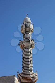 Slender ornate minaret. Ancient Circassian village of Kafr Kama in Israel
