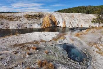 Yellowstone National Park. Famous fumaroles with hot water azure.
