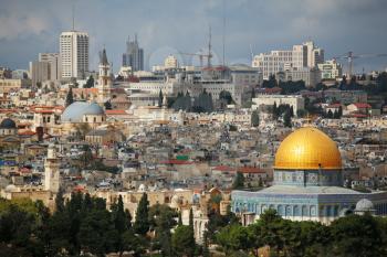  Magnificent panorama of Jerusalem. Dome of the Rock and Dome of the Holy Sepulcher.
On a background - modern skyscrapers and elevating cranes of new buildings