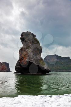 Foggy morning after a storm. The island-rock Monkey Sawasdee Island in the Thai gulf
