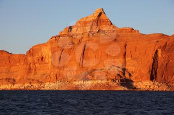 Magnificent red sandstone cliffs on the shores of Lake Powell. Arizona, United States