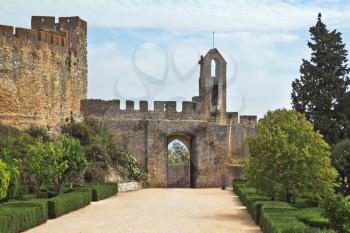 The entrance to the fortress of the Knights Templar. Fortress protective wall surrounding the dilapidated medieval castle Templar