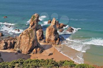  Coast of Portugal, cape Kabo-da-Roca. Picturesque, the freakish form of a rock on the bank of Atlantic ocean.
