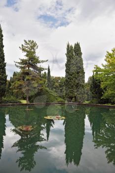 Fabulously beautiful park-garden Sigurta. Ornamental pond and colorful flowers and trees