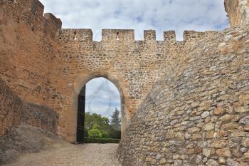 Powerful gear defensive walls and a way out of the park.  The imposing medieval castle - the monastery of the Templars