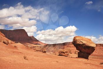 Gorgeous American Red Desert. A huge mushroom out of red sandstone. Solar hot afternoon