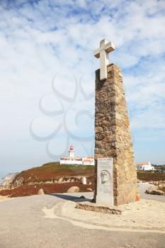Extreme western point of Europe. Lighthouse and memorial obelisk with a large cross