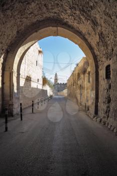  Arch and narrow street in the old quarters of the eternal Jerusalem