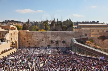 The most joyful holiday of the Jewish people - Sukkot. The Western Wall of the Jerusalem temple. The area before it is filled up by people on time of a morning prayer