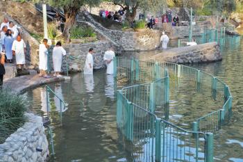 Yardenit, Israel - January 21: Baptism of Christian pilgrims in the holy waters of the Jordan River in the days of the Feast of Holy Baptism 21 January 2012 at Pilgrim baptismal site Yardenit, Israel.