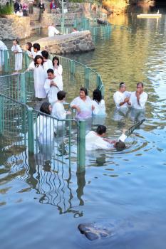 Yardenit, Israel - January 21: The ritual baptism of Christian pilgrims in the sacred waters of the Jordan River in the days of the Feast of Holy Baptism 21 January 2012 at Pilgrim baptismal site Yard