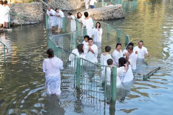Yardenit, Israel - January 21: The ritual baptism of Christian pilgrims in the sacred waters of the Jordan River in the days of the Feast of Holy Baptism 21 January 2012 at Pilgrim baptismal site Yard