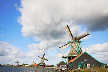 Rural landscape in Holland. Ethnographic rural museum - rural constructions and windmills - a country symbol