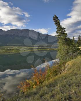 Silent lake in the early autumn morning in mountains