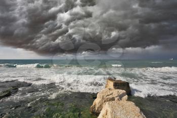 Severe storm cloud over the surf. Mediterranean Sea, Israel