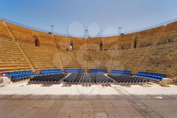  An amphitheater of the period of the Roman invasion in national park Caesarea on Mediterranean sea