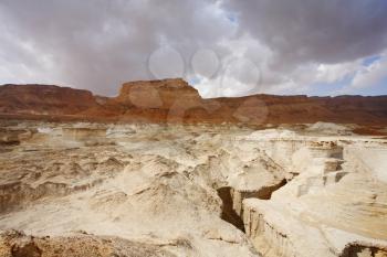 Huge dry sandy canyon in ancient mountains of the Dead Sea