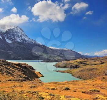 Chilean Patagonia. Snow-capped mountain peaks and fabulous lake with emerald water