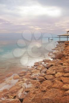 Winter in the Dead Sea. Sandy shallow beach