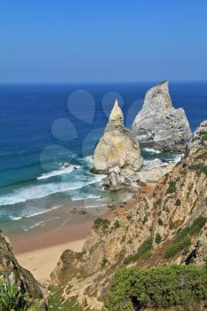 Coast of Portugal, Cape Cabo da Roca - the westernmost point of Europe. Picturesque rocks, similar to ice cream. Morning sunrise