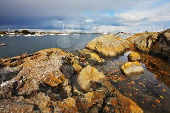 Stony coast of passage which separates island Vancouver from Pacific ocean