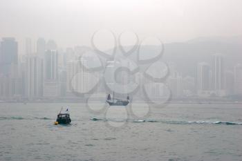  The small ships in port of Hong Kong during time of a fog 