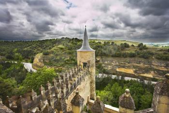 Ancient picturesque castle of the Spanish kings in Segovia and rural fields