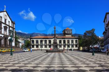 FUNCHAL, MADEIRA - OCTOBER 08, 2011: The main square of the city. Before administration building stands a memorial monument